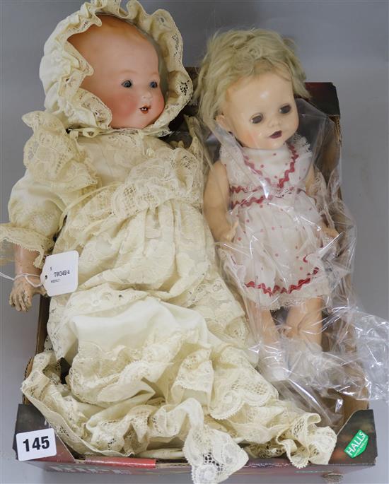 An Armand Marseille Dream Baby doll, No. 341/4K, dressed in Christening gown and bonnet and four other dolls,